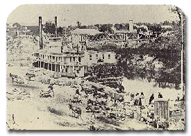 The paddlewheeler St. Claire of Galveston loading cotton at the foot of Main Street, circa 1860s.